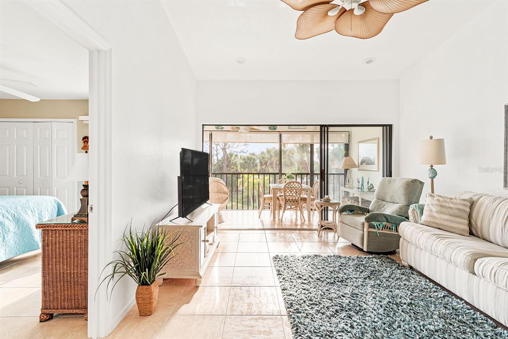 4260 Placida Road, Unit 12C Englewood, FL 34224 - Photo 13 of 57 a living room with furniture and a large window