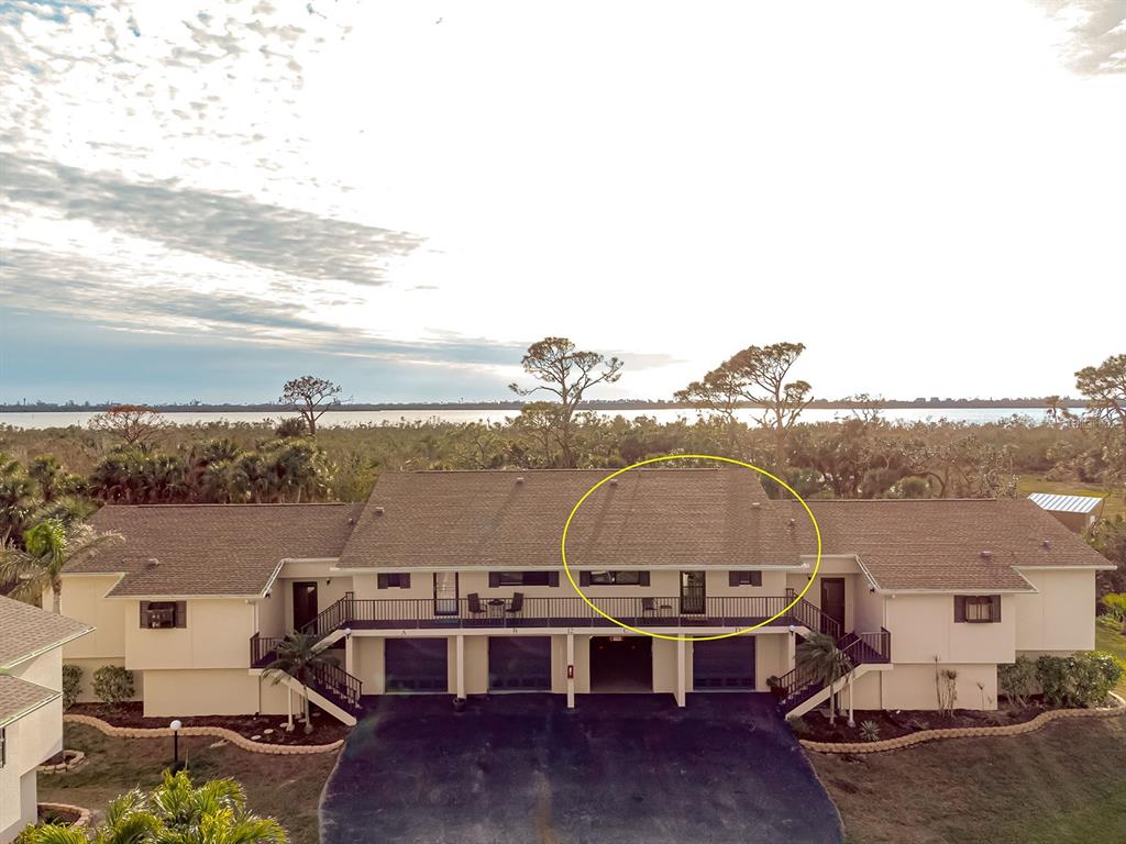 4260 Placida Road, Unit 12C Englewood, FL 34224 - Photo 2 of 57 a view of a ocean with a building in the background