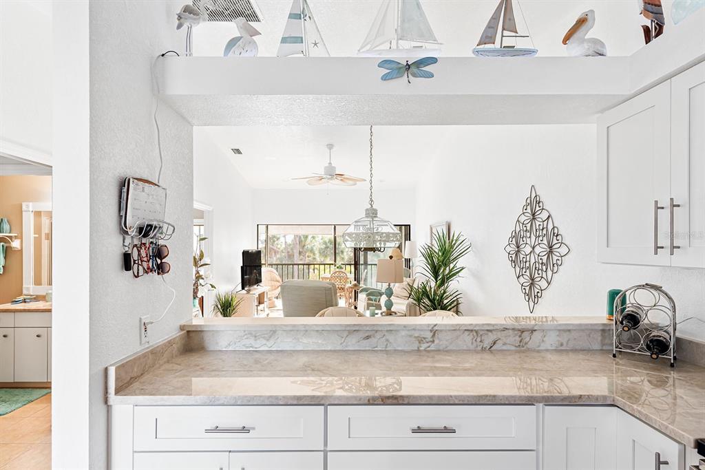 4260 Placida Road, Unit 12C Englewood, FL 34224 - Photo 21 of 57 a view of living room with granite countertop a sink and potted plant