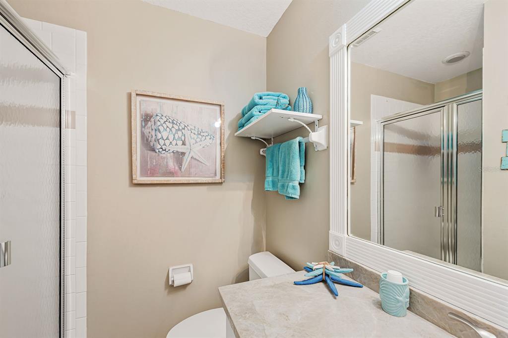 4260 Placida Road, Unit 12C Englewood, FL 34224 - Photo 27 of 57 a bathroom with a toilet and a shower
