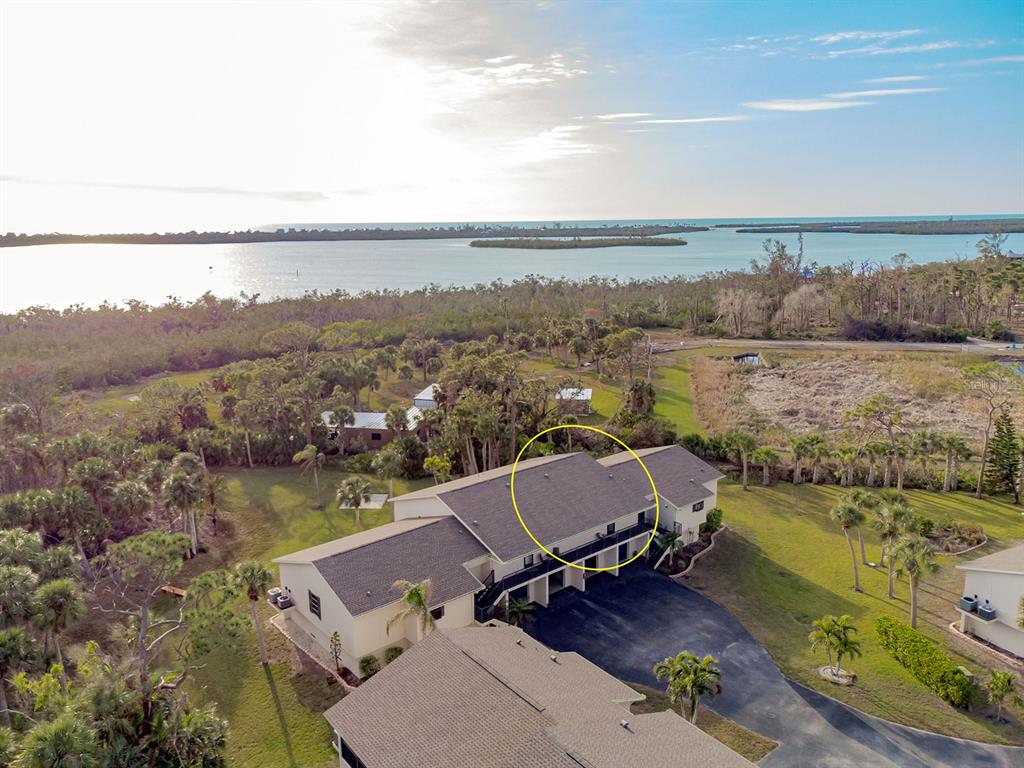 4260 Placida Road, Unit 12C Englewood, FL 34224 - Photo 4 of 57 an aerial view of a residential houses with outdoor space