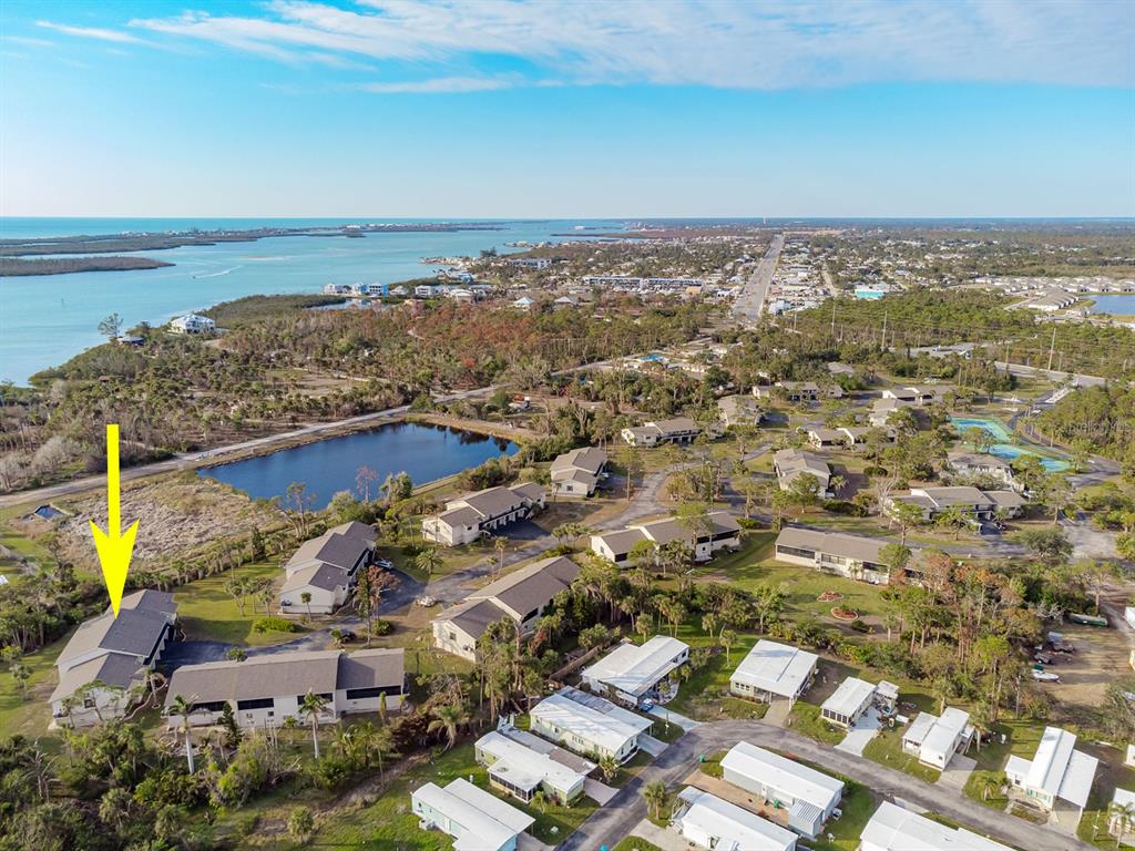 4260 Placida Road, Unit 12C Englewood, FL 34224 - Photo 5 of 57 an aerial view of residential building and ocean