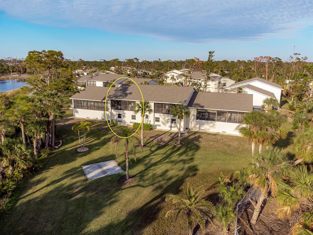 4260 Placida Road, Unit 12C Englewood, FL 34224 - Photo 6 of 57 an aerial view of residential houses with outdoor space