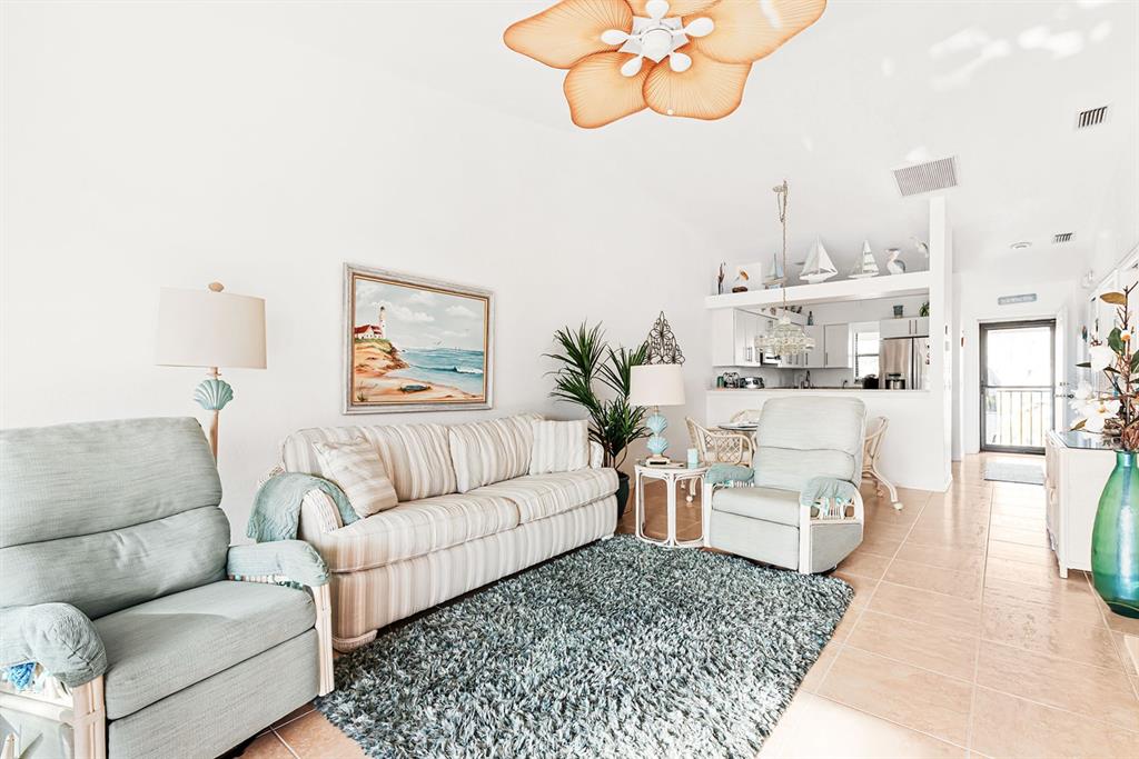 4260 Placida Road, Unit 12C Englewood, FL 34224 - Photo 10 of 57 a living room with furniture and a couch