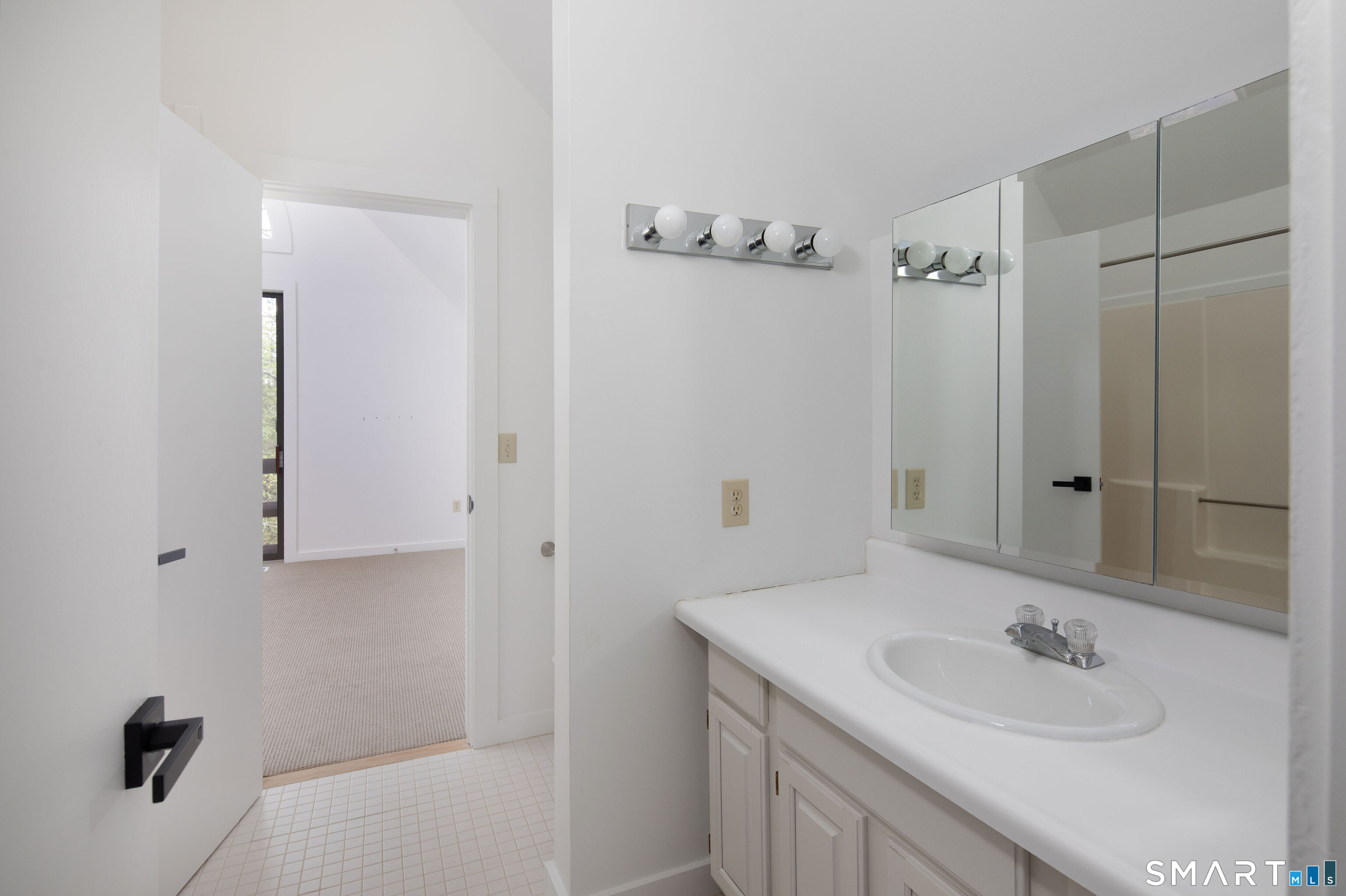 290 Indian Mountain Road Salisbury, CT 06039 - Photo 13 of 16 a bathroom with a sink and a mirror