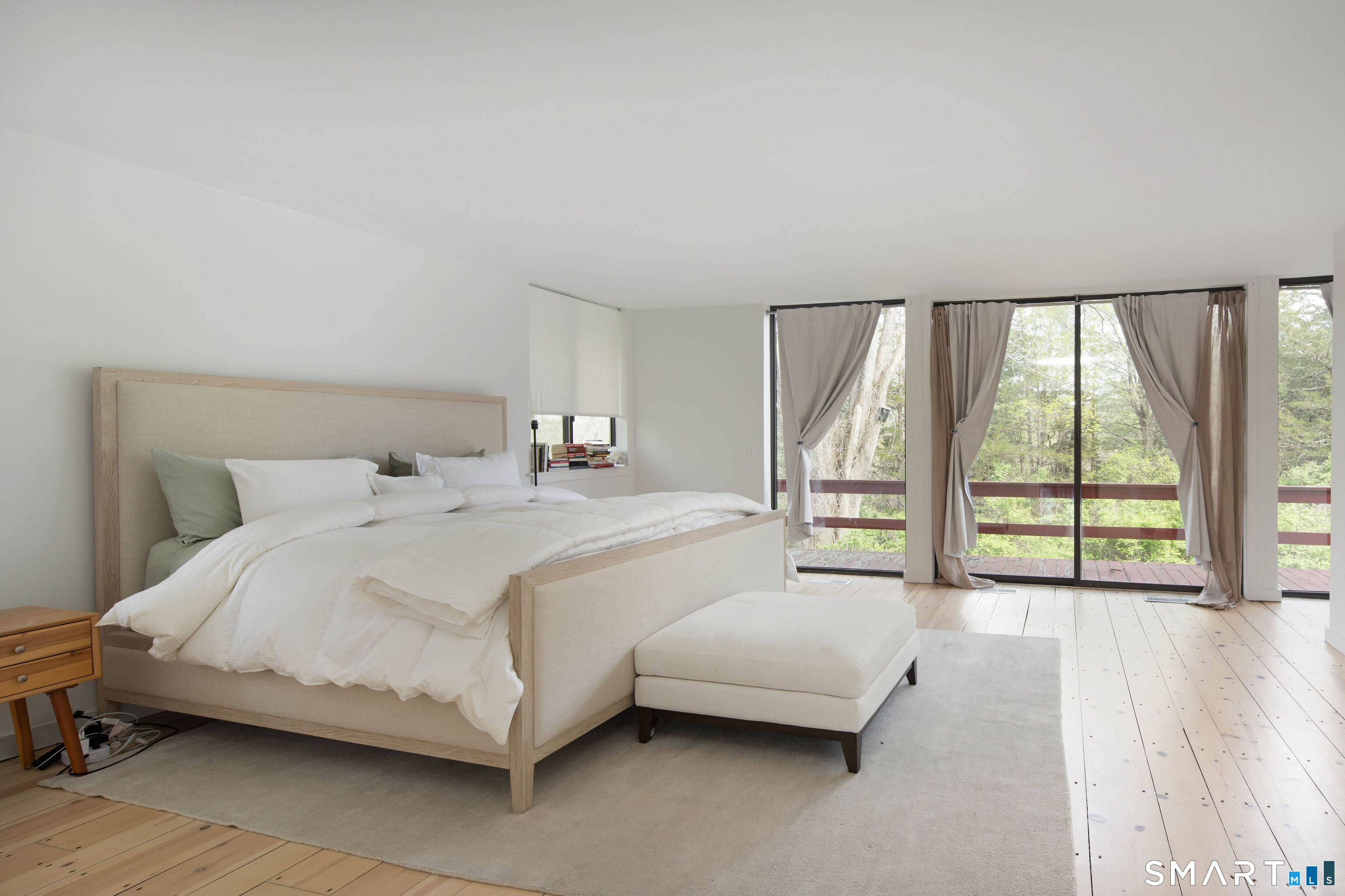 290 Indian Mountain Road Salisbury, CT 06039 - Photo 8 of 16 a spacious bedroom with a bed and a large window