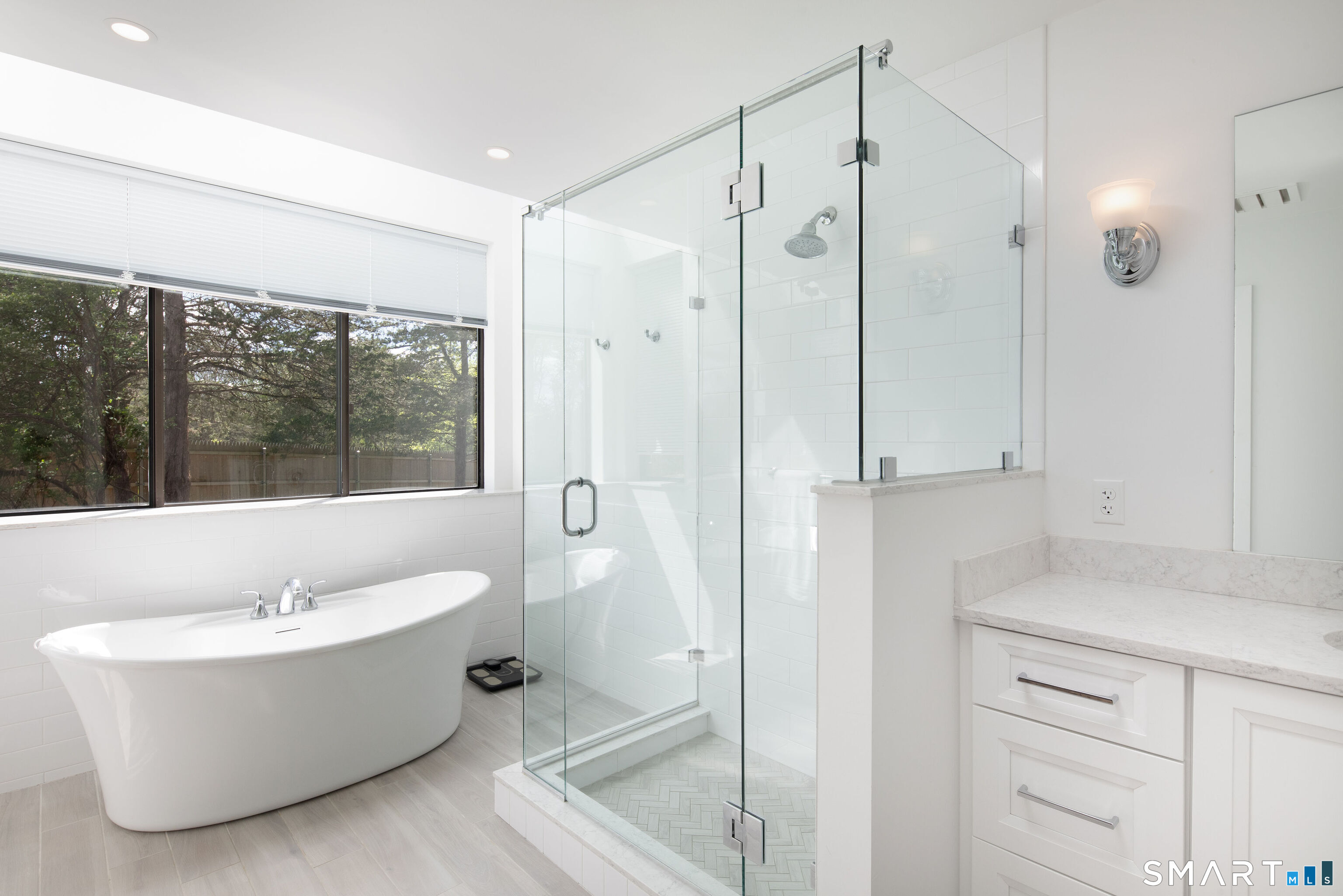290 Indian Mountain Road Salisbury, CT 06039 - Photo 9 of 16 a bathroom with a white tub shower vanity and sink