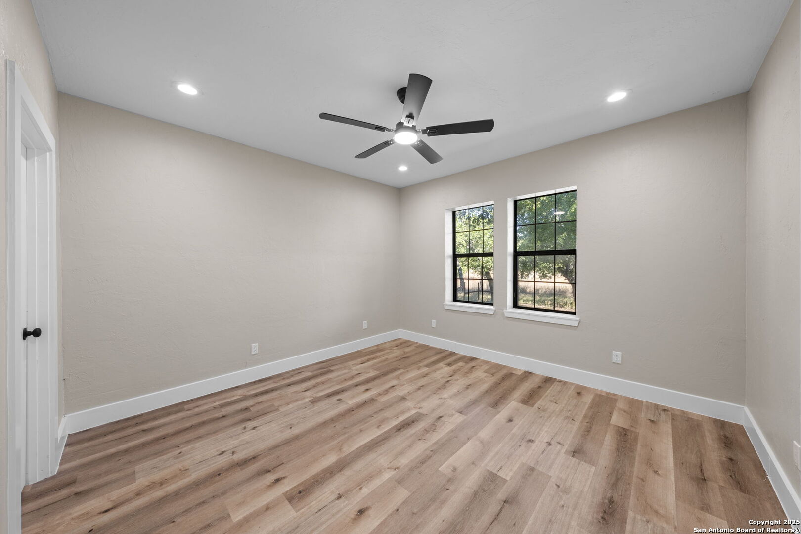 28 Ruger Road Fredericksburg, TX 78624 - Photo 25 of 46 an empty room with a window and a ceiling fan