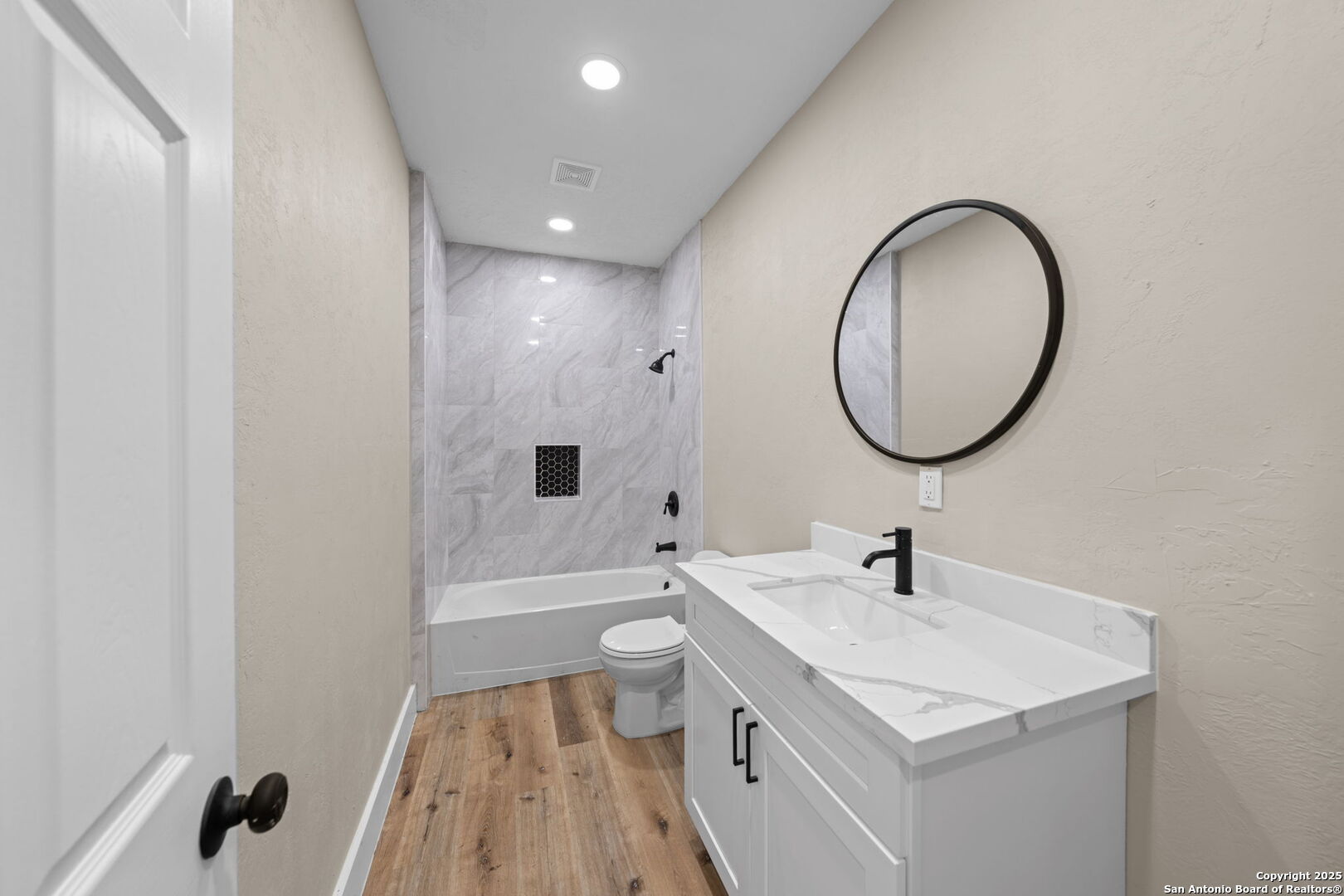 28 Ruger Road Fredericksburg, TX 78624 - Photo 27 of 46 a bathroom with a sink a toilet and a mirror