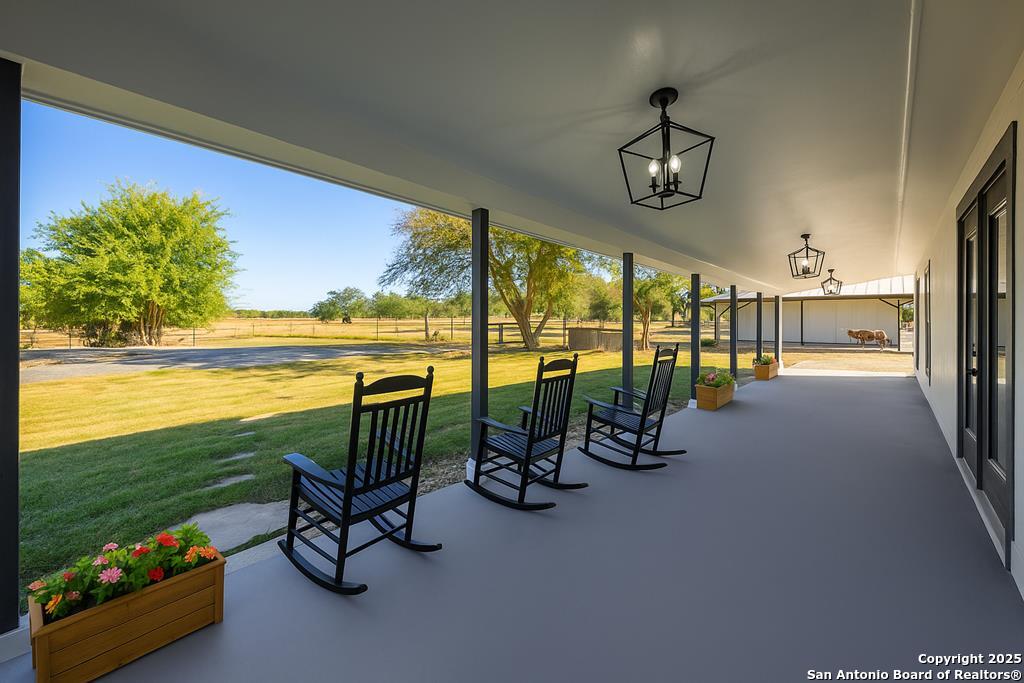 28 Ruger Road Fredericksburg, TX 78624 - Photo 4 of 46 a view of a livingroom with floor to ceiling window and hardwood