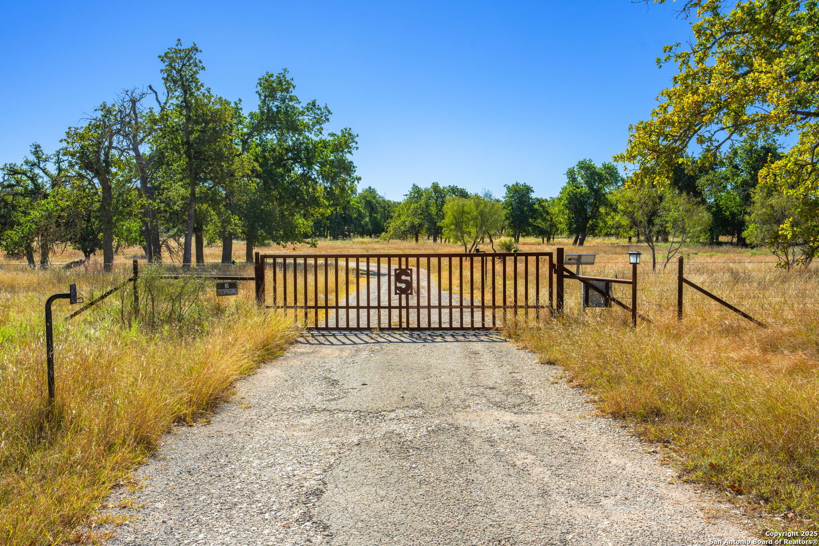 28 Ruger Road Fredericksburg, TX 78624 - Photo 41 of 46 a view of backyard with swimming pool and trees in the background