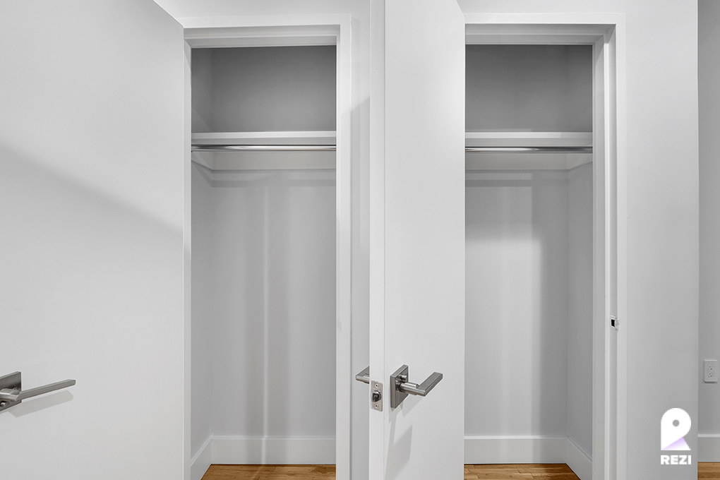 a view of walk in closet with cabinet