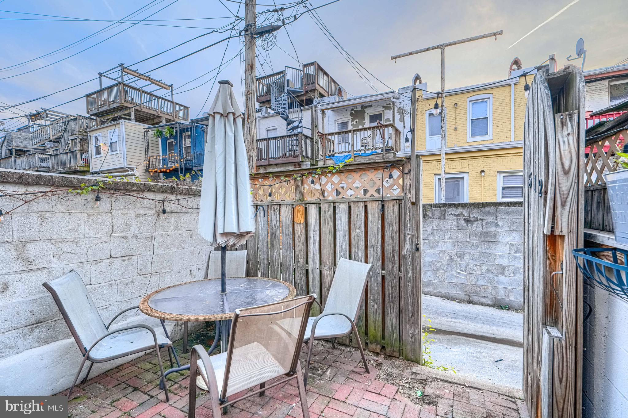 512 South Curley Street Baltimore, MD 21224 - Photo 18 of 29 a view of a patio with table and chairs