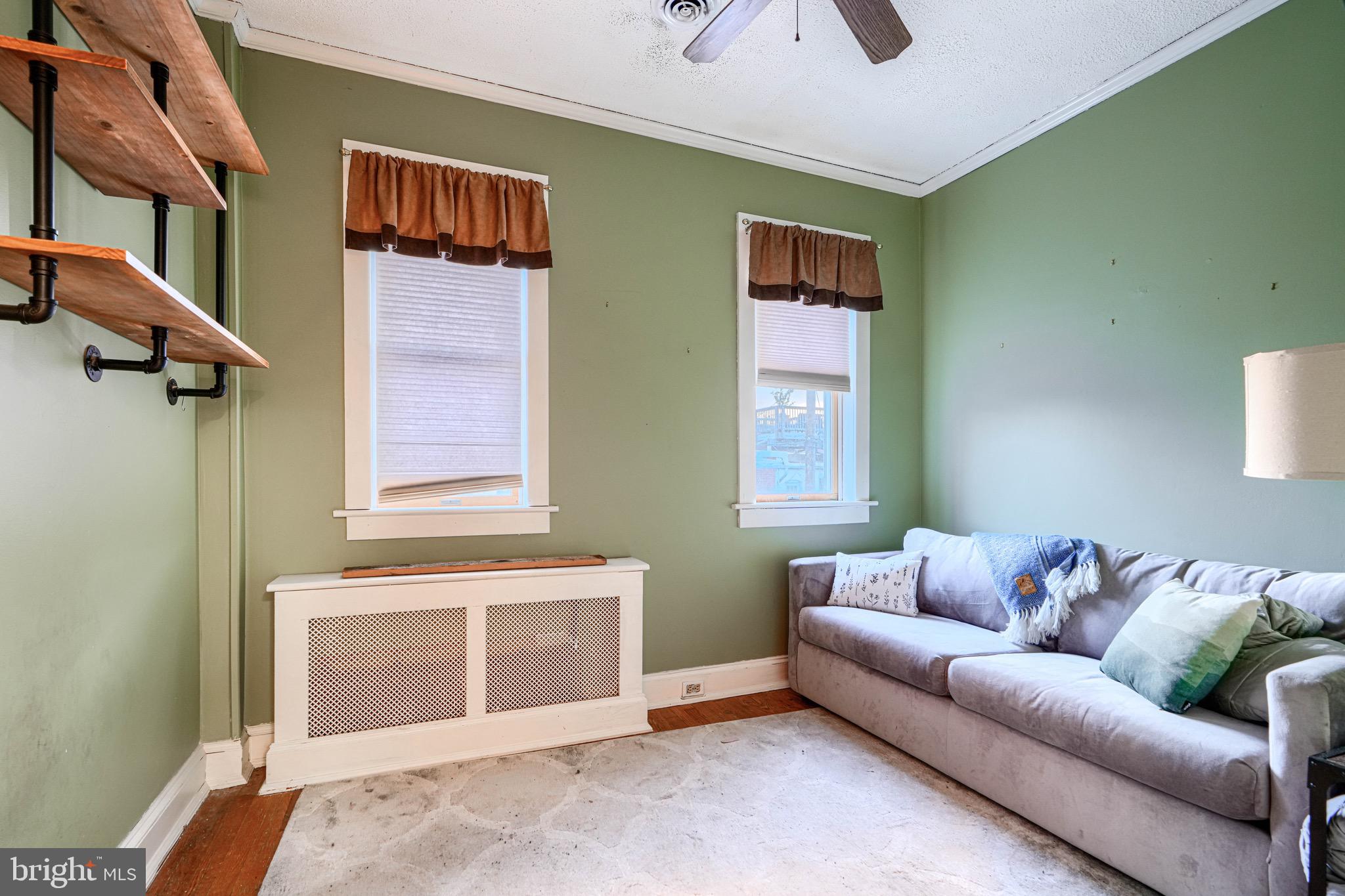 512 South Curley Street Baltimore, MD 21224 - Photo 20 of 29 a living room with furniture and a window