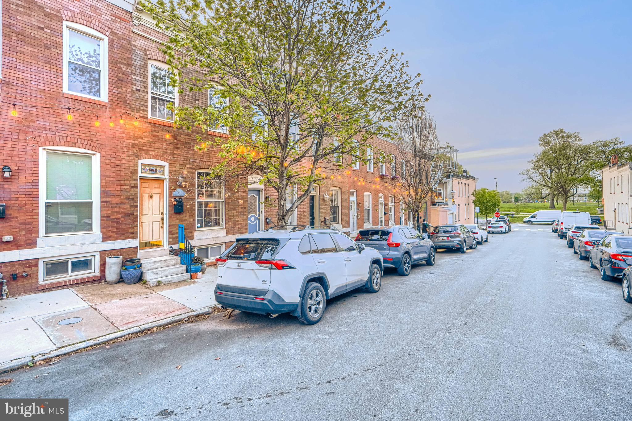 512 South Curley Street Baltimore, MD 21224 - Photo 2 of 29 a car parked in front of a brick building