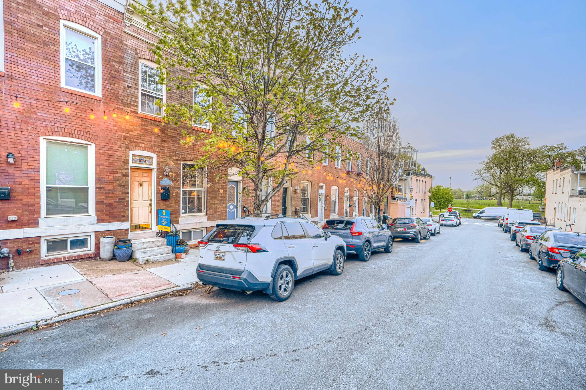 512 South Curley Street Baltimore, MD 21224 - Photo 3 of 29 a car parked in front of brick building