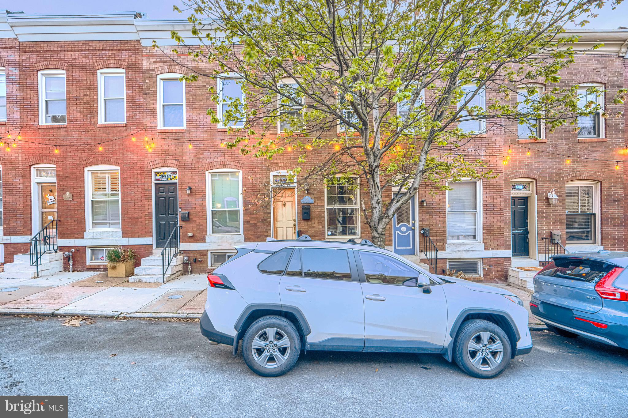 512 South Curley Street Baltimore, MD 21224 - Photo 4 of 29 a front view of a house with parking space