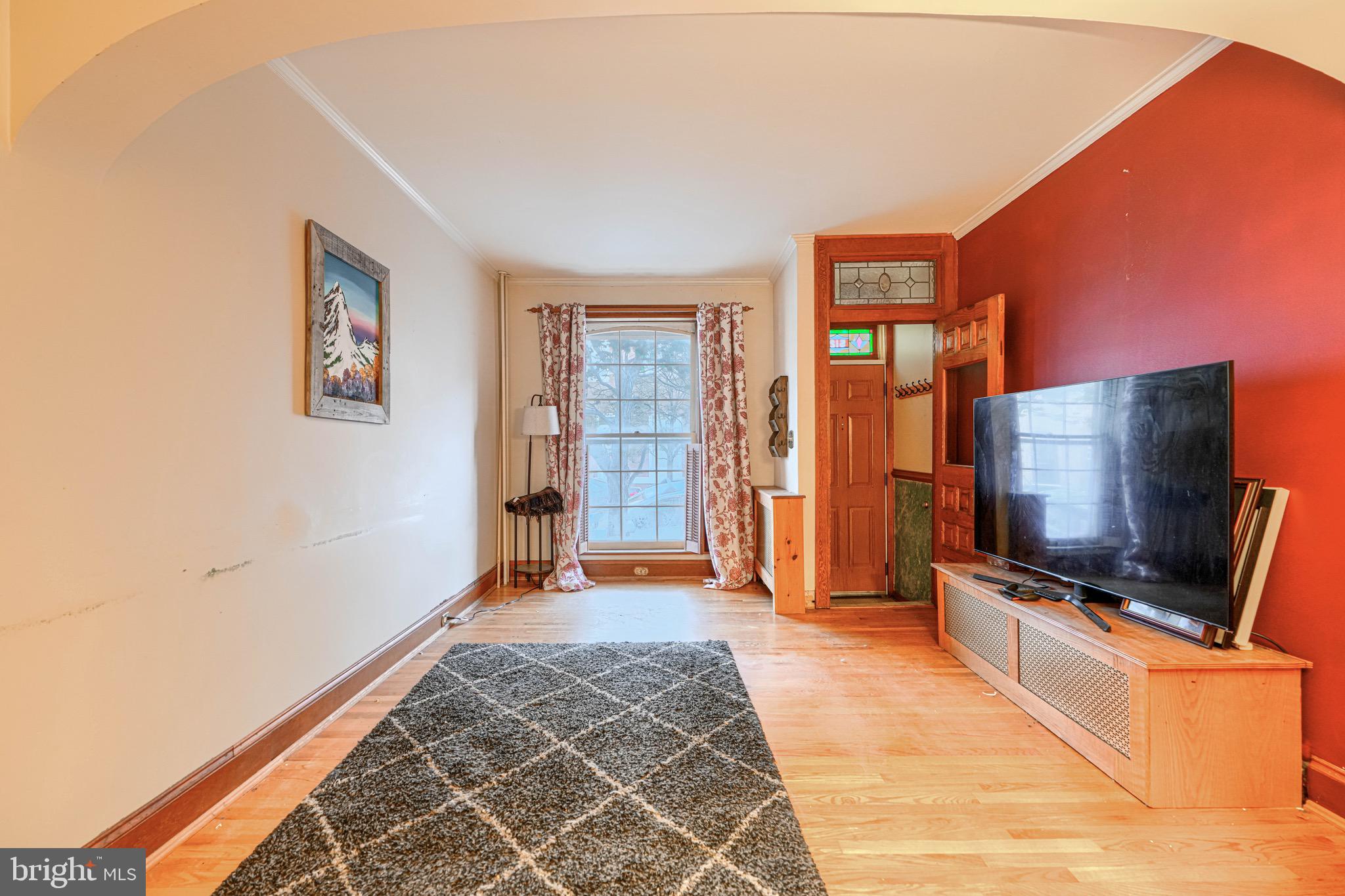 512 South Curley Street Baltimore, MD 21224 - Photo 8 of 29 a view of an empty room with a flat screen tv