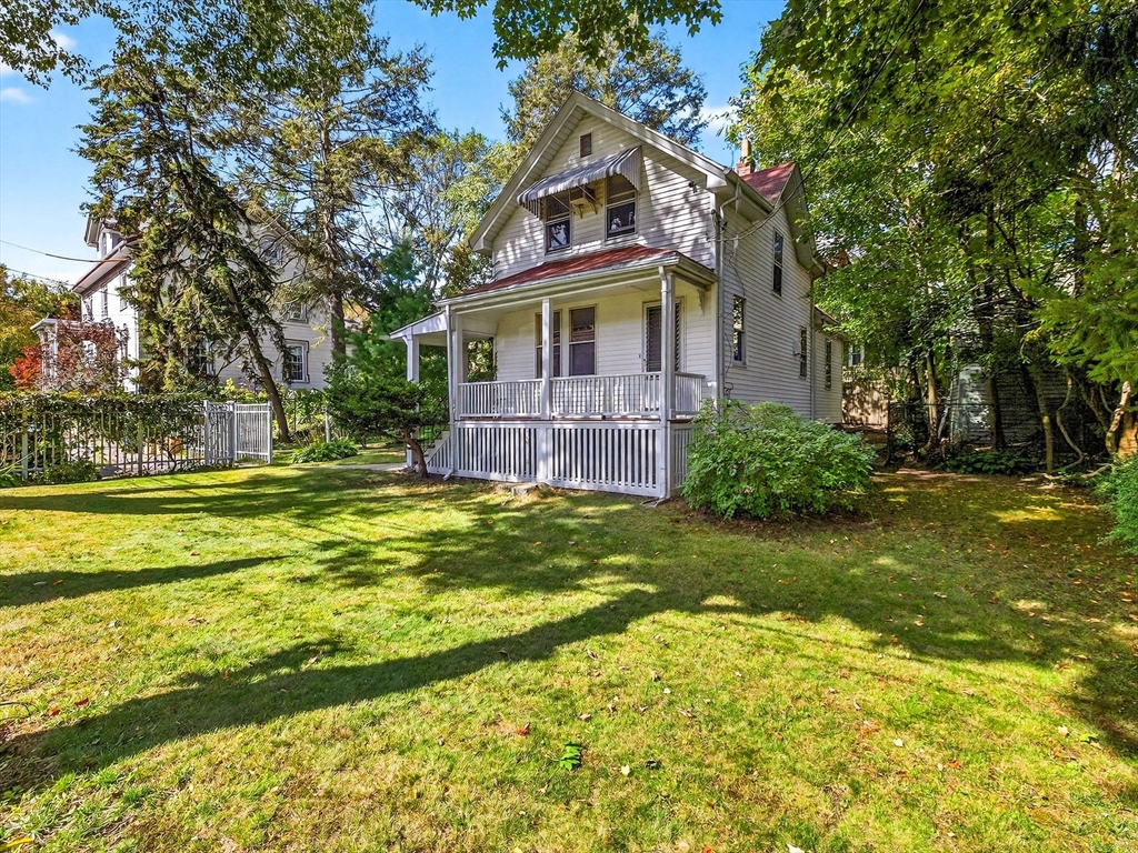 a front view of house with outdoor space and garden