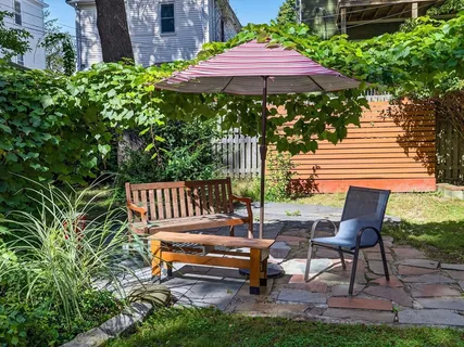 a garden view with a seating space