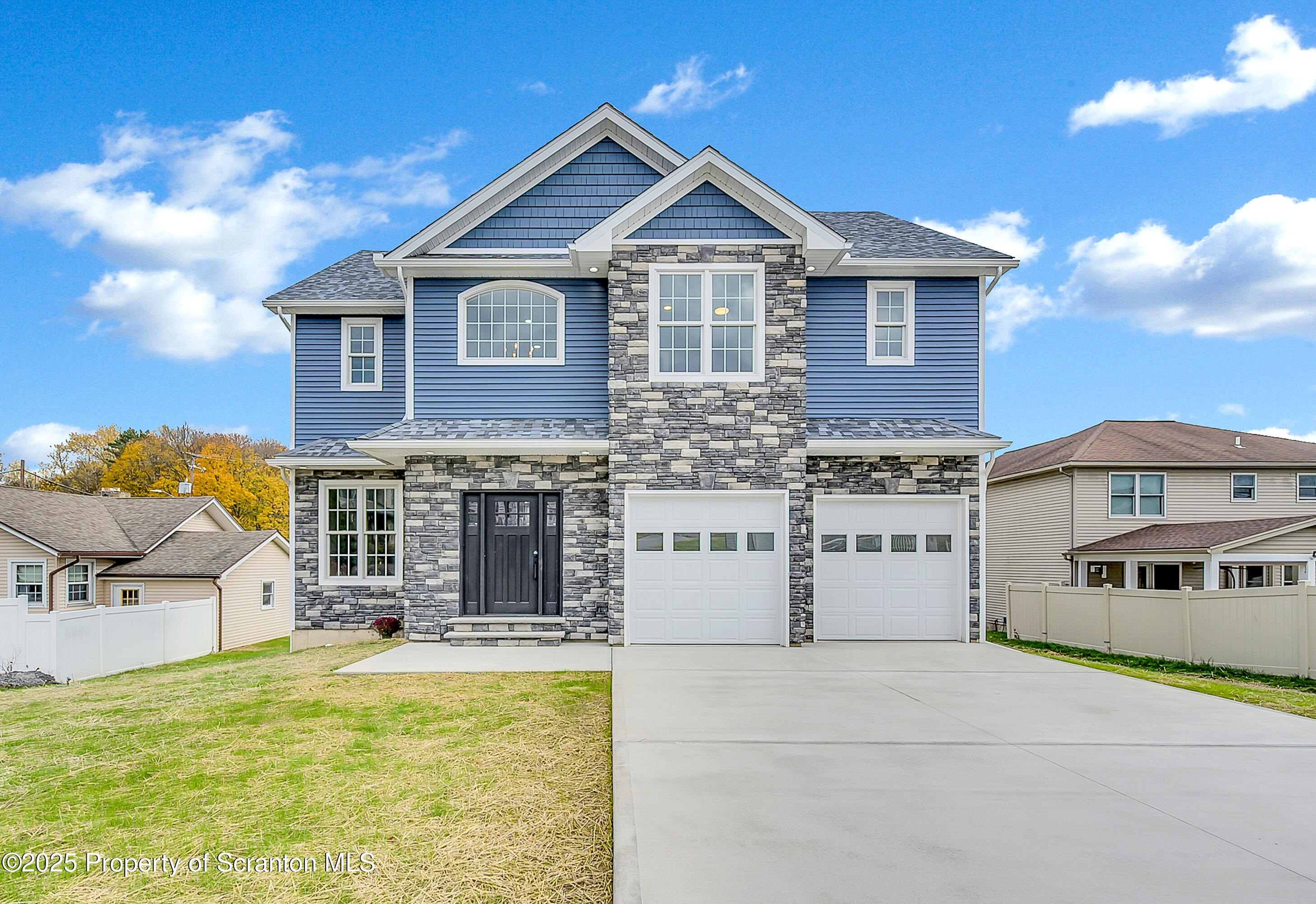 a view of a house with a yard and sitting space