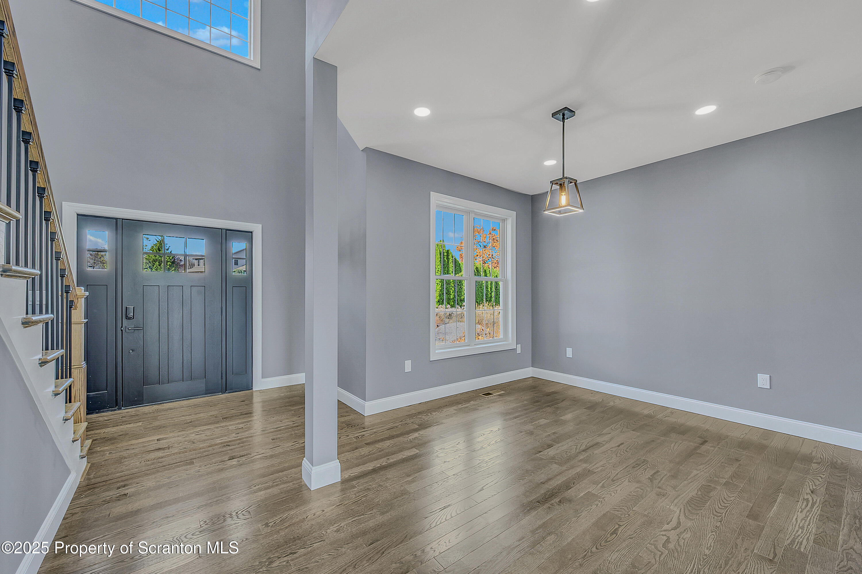 11 Riverview Drive Jessup, PA 18434 - Photo 16 of 58 an empty room with wooden floor and windows