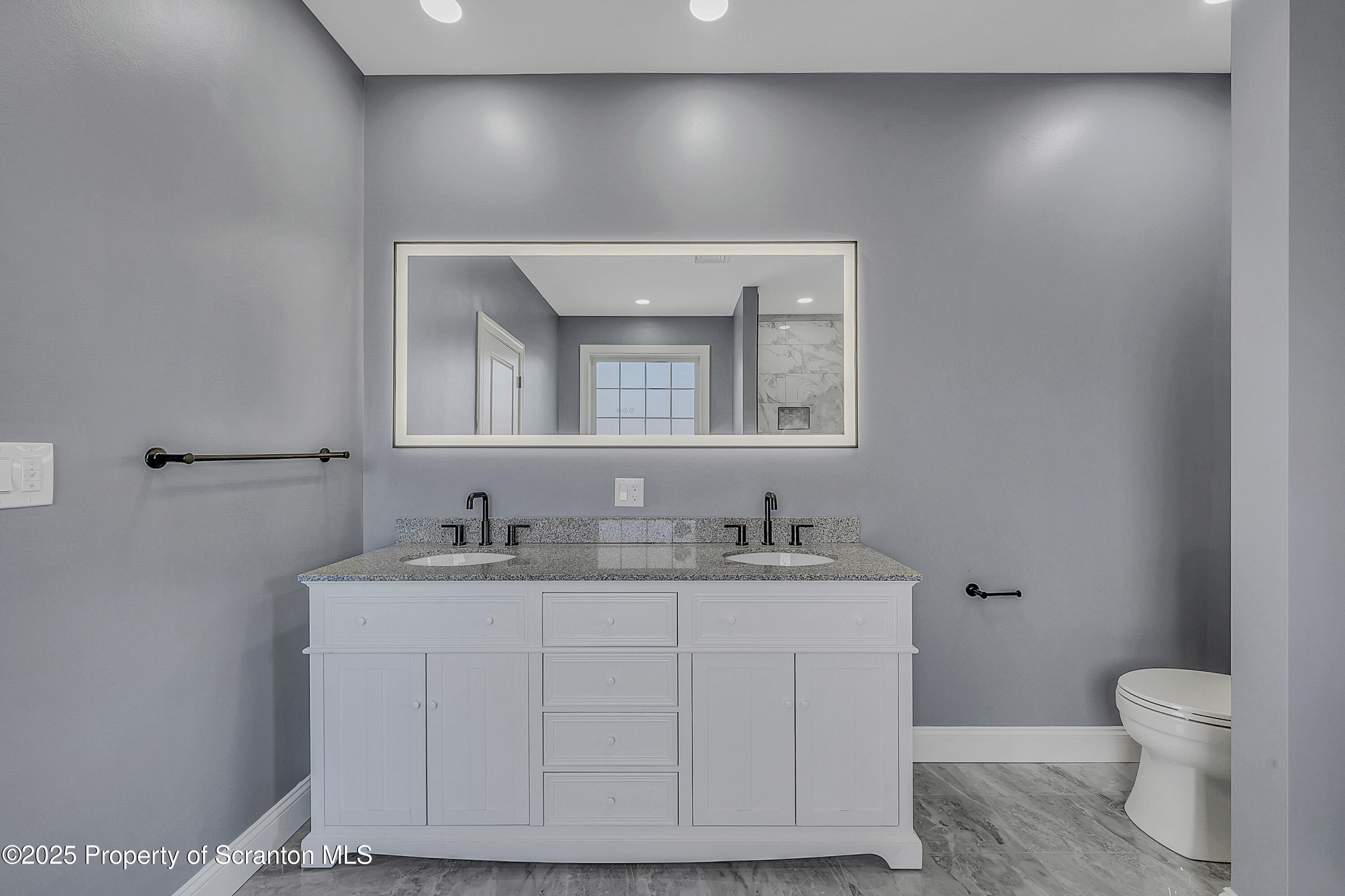 11 Riverview Drive Jessup, PA 18434 - Photo 35 of 58 a bathroom with a toilet a sink and mirror