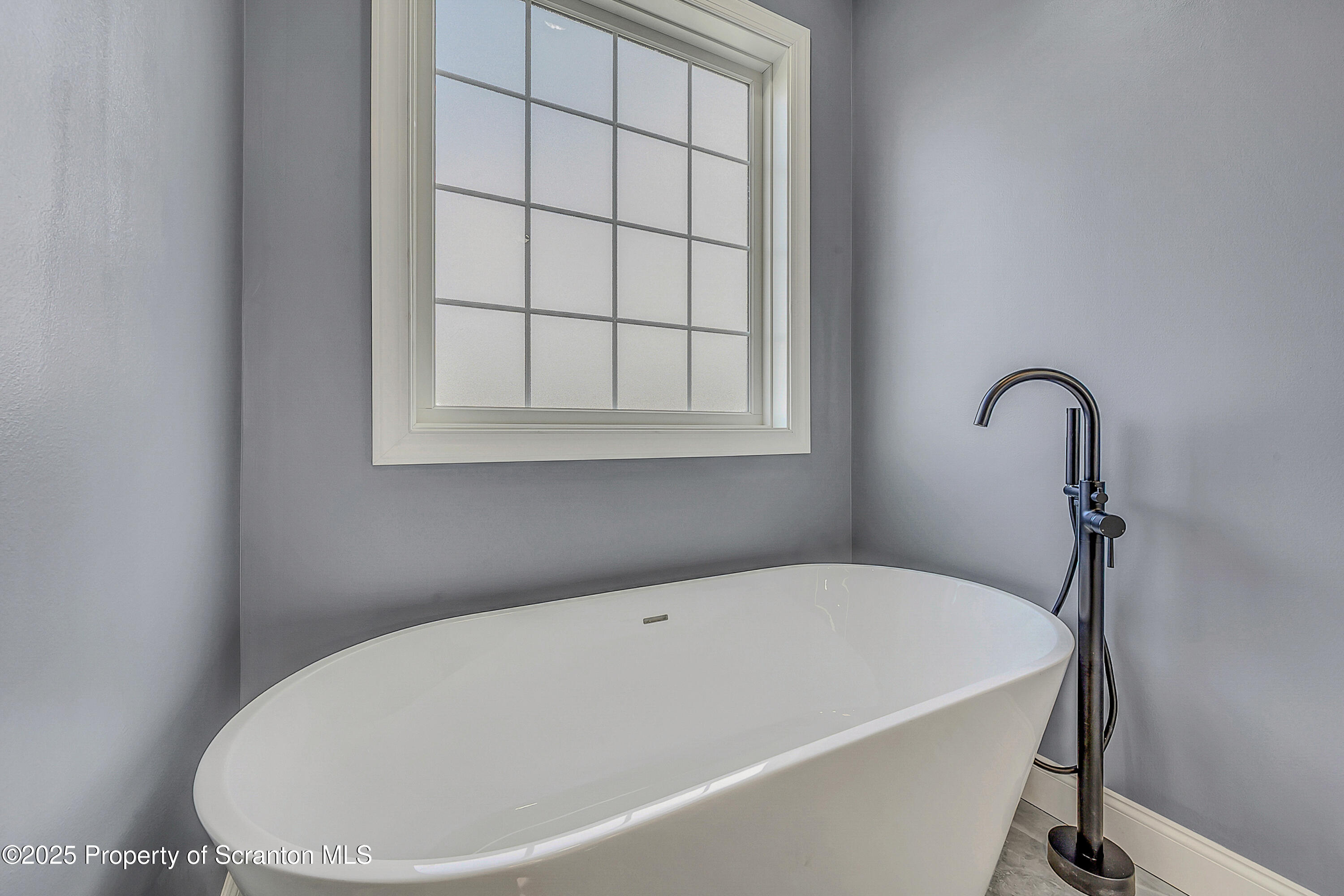 11 Riverview Drive Jessup, PA 18434 - Photo 37 of 58 a white bath tub sitting next to a window