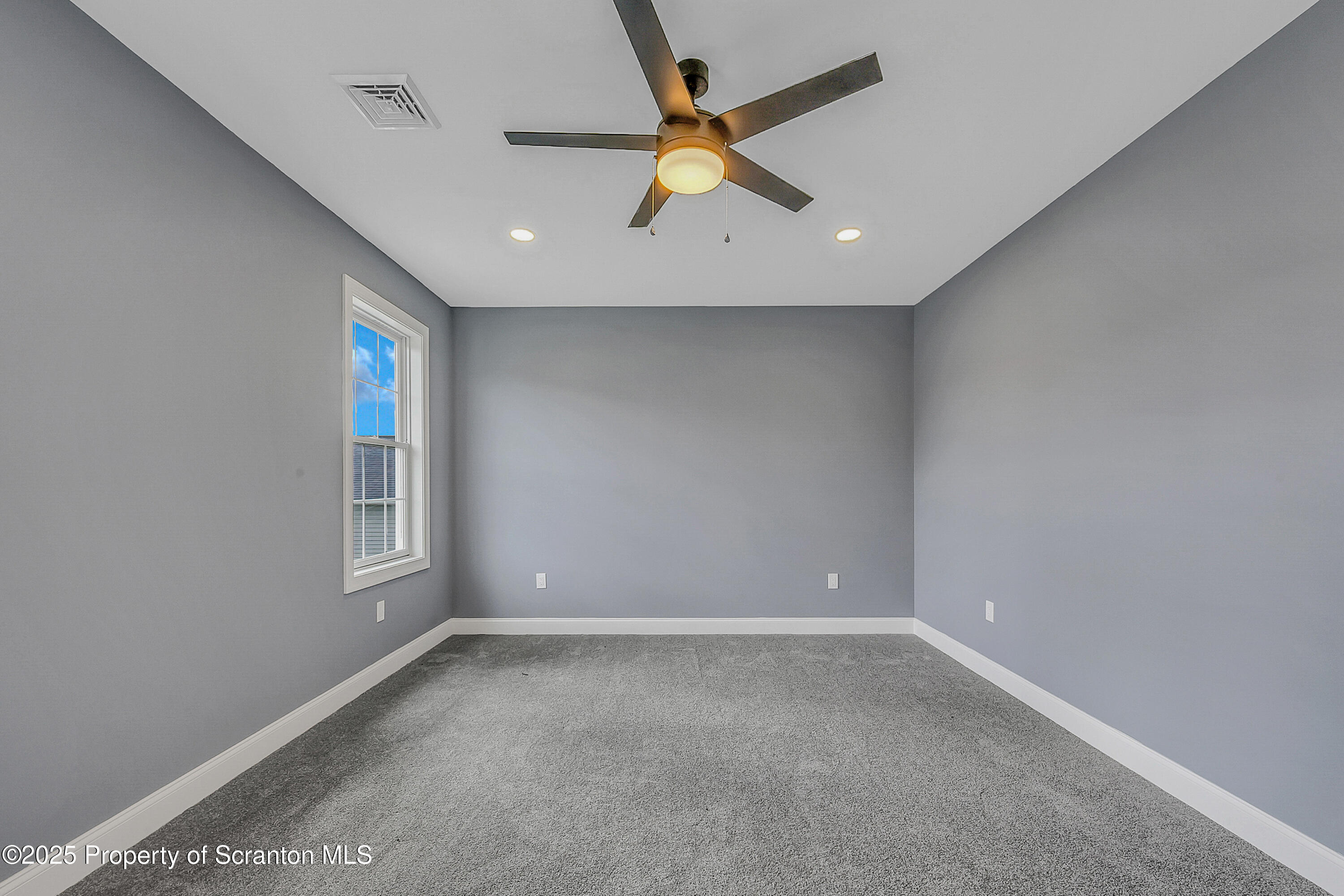 11 Riverview Drive Jessup, PA 18434 - Photo 45 of 58 an empty room with a window and a fan