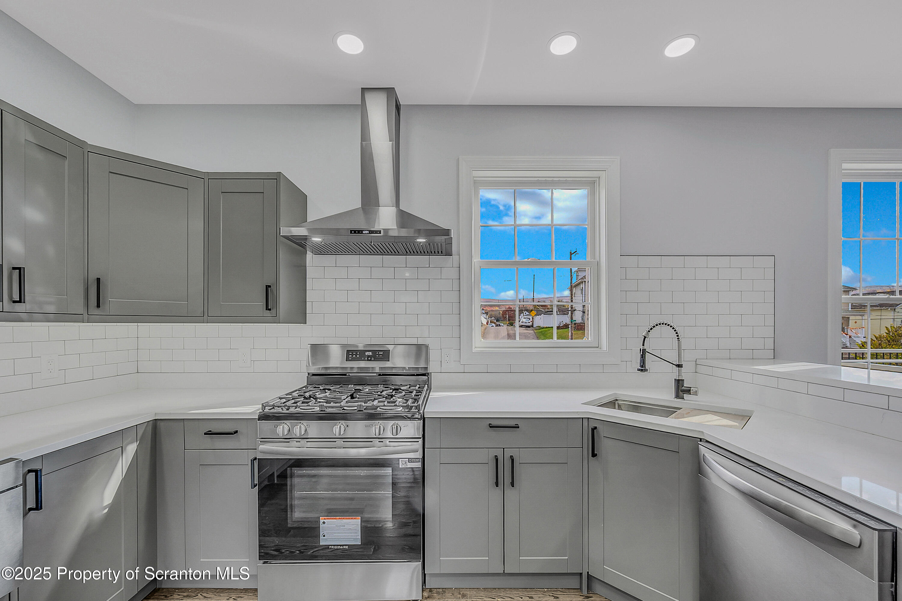 11 Riverview Drive Jessup, PA 18434 - Photo 6 of 58 a kitchen with stainless steel appliances granite countertop a sink stove and cabinets