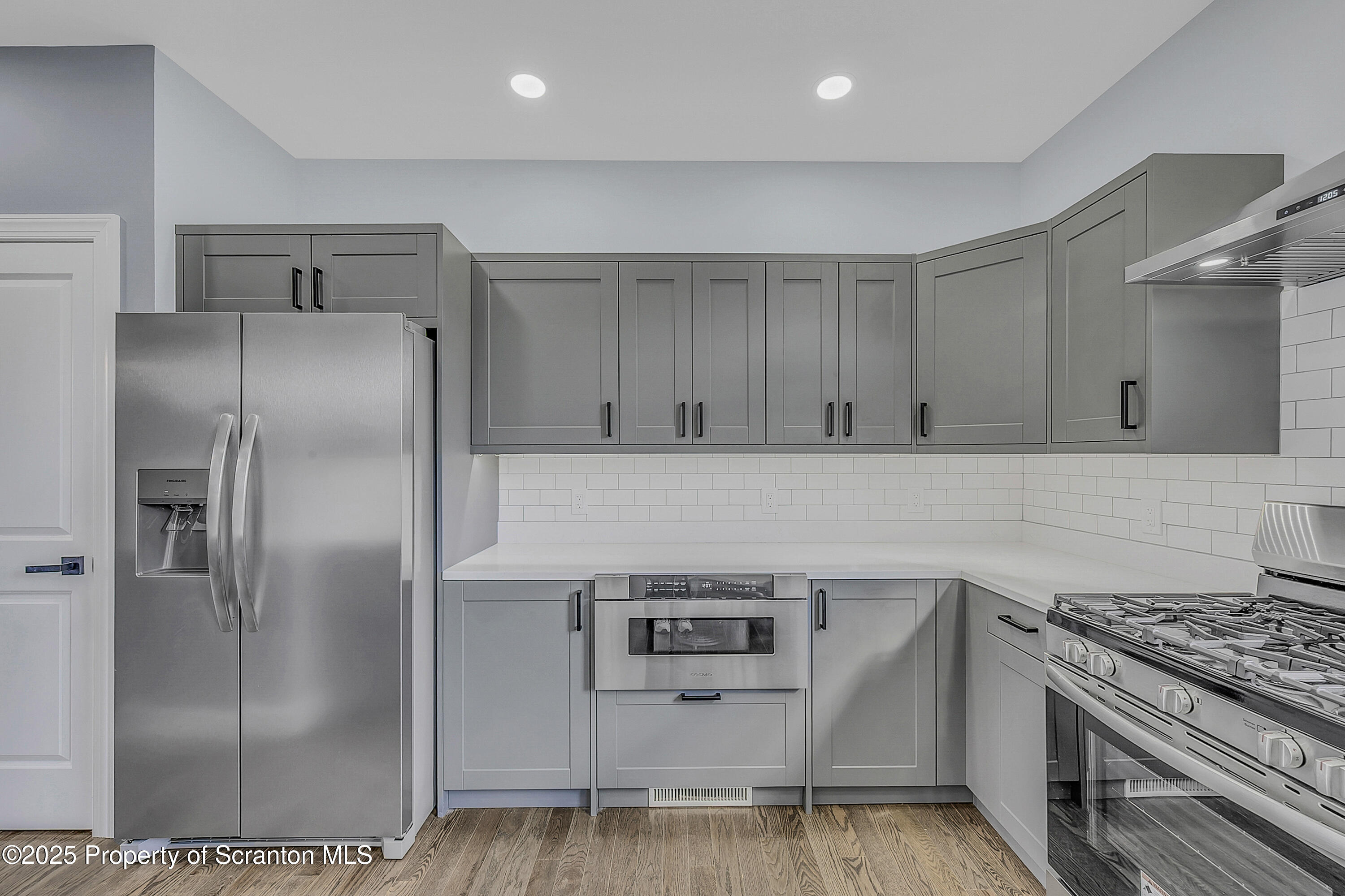 11 Riverview Drive Jessup, PA 18434 - Photo 8 of 58 a kitchen with stainless steel appliances granite countertop a refrigerator and a stove