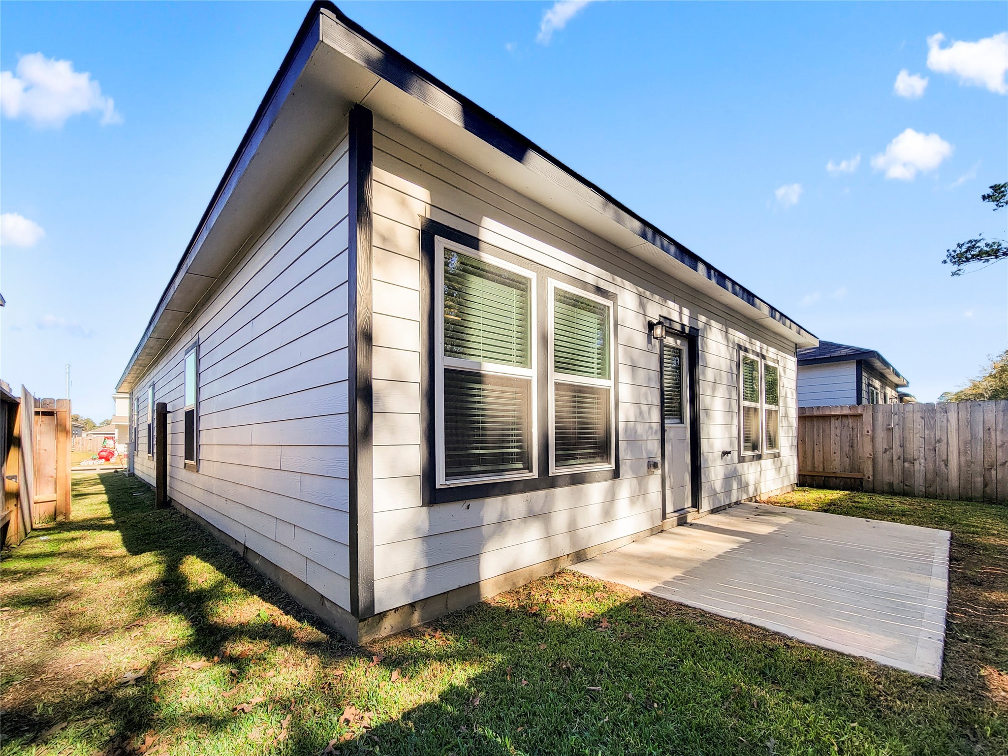 16954 Pandora Way Porter, TX 77365 - Photo 16 of 18 a front view of a house with a yard