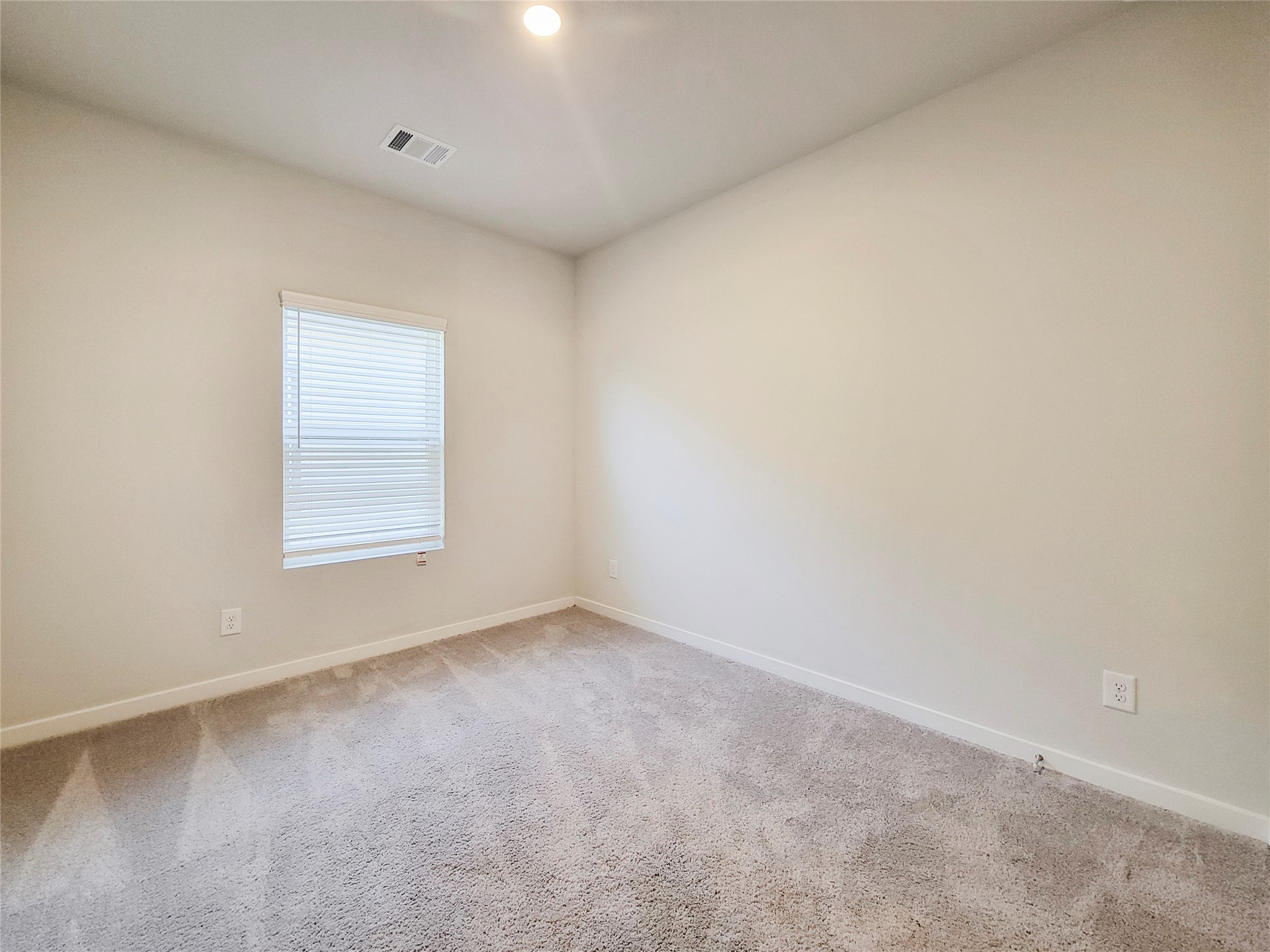 16954 Pandora Way Porter, TX 77365 - Photo 9 of 18 an empty room with a window
