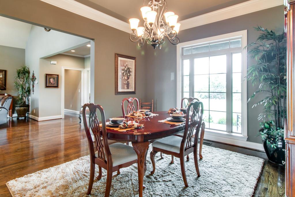 2210 Dr Robertson Road Spring Hill, TN 37174 - Photo 13 of 24 a view of a dining room with furniture window and wooden floor