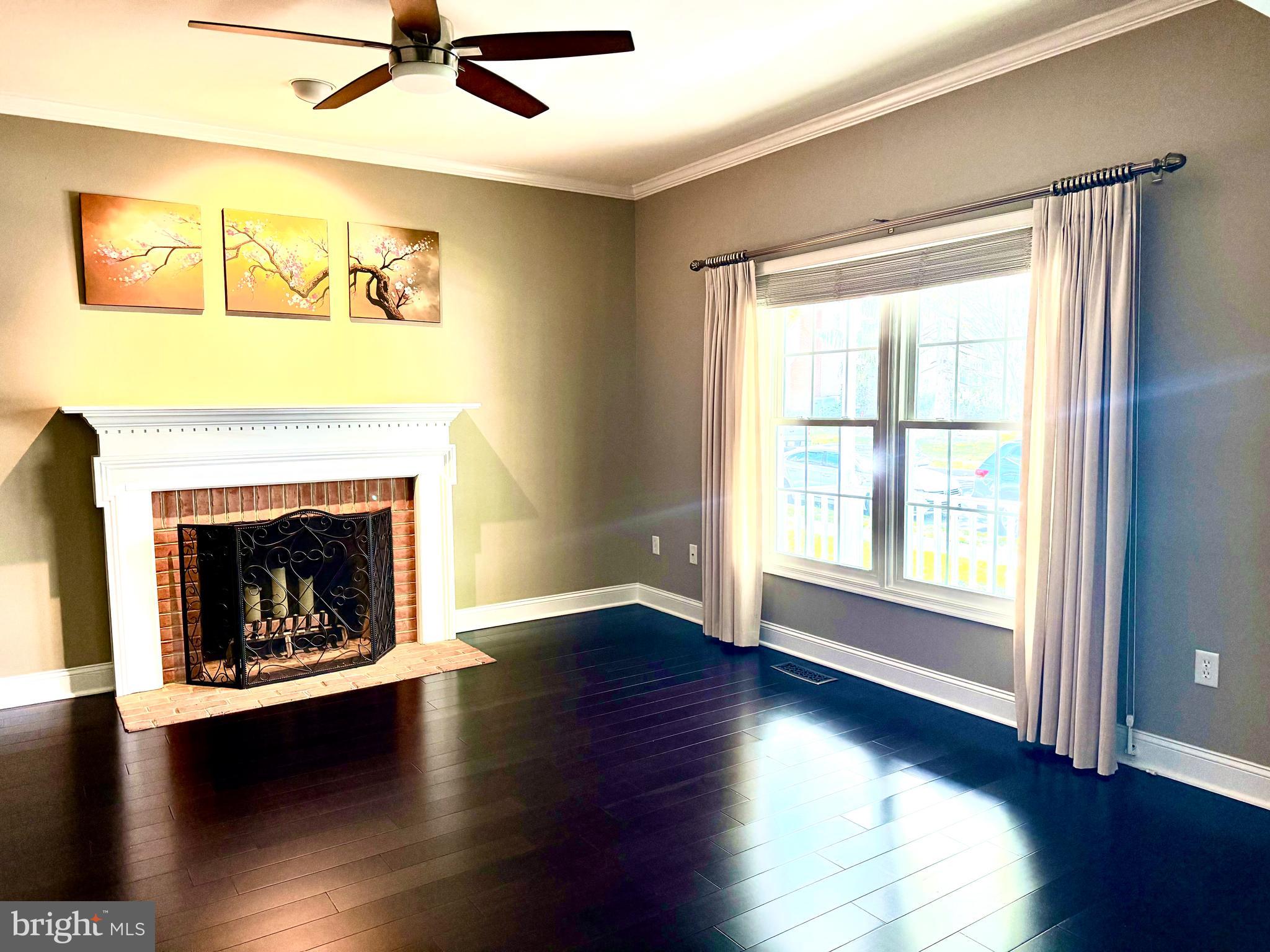 2462 Five Shillings Road Frederick, MD 21701 - Photo 13 of 55 a living room with wooden floor and a fireplace
