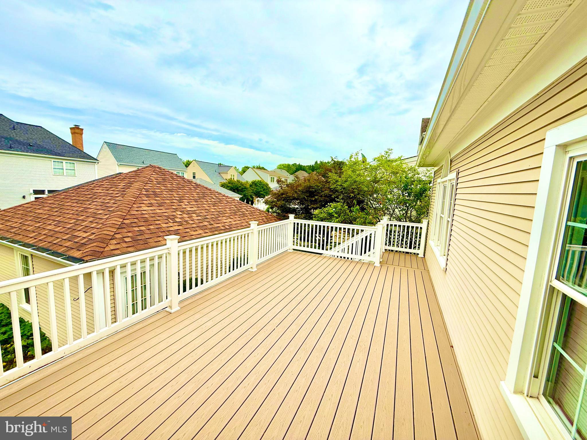 2462 Five Shillings Road Frederick, MD 21701 - Photo 33 of 55 a view of a balcony with wooden floor and fence