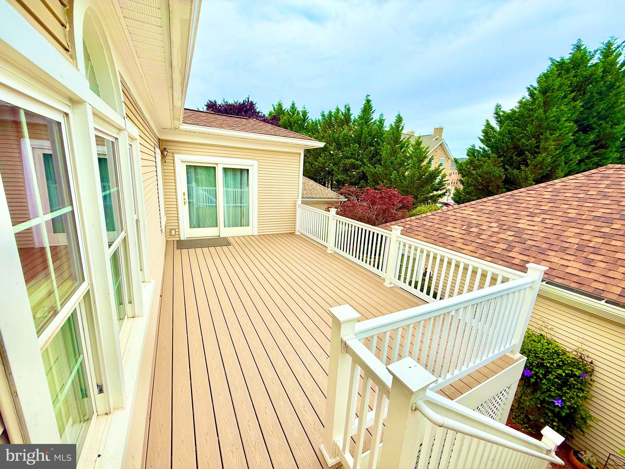 2462 Five Shillings Road Frederick, MD 21701 - Photo 34 of 55 a view of a balcony with wooden floor and fence