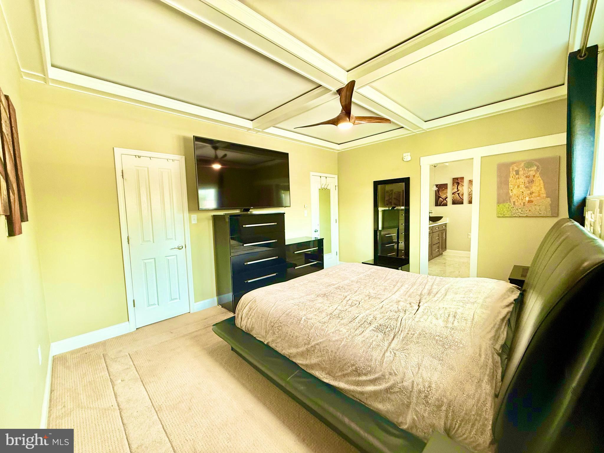 2462 Five Shillings Road Frederick, MD 21701 - Photo 36 of 55 a bedroom with a bed dresser and a flat tv screen