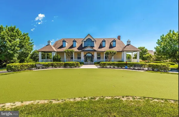 a front view of a house with swimming pool