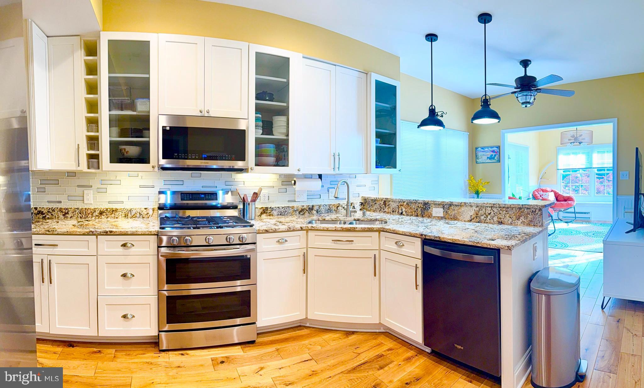 2462 Five Shillings Road Frederick, MD 21701 - Photo 5 of 55 a kitchen with stainless steel appliances granite countertop a stove a sink and a microwave