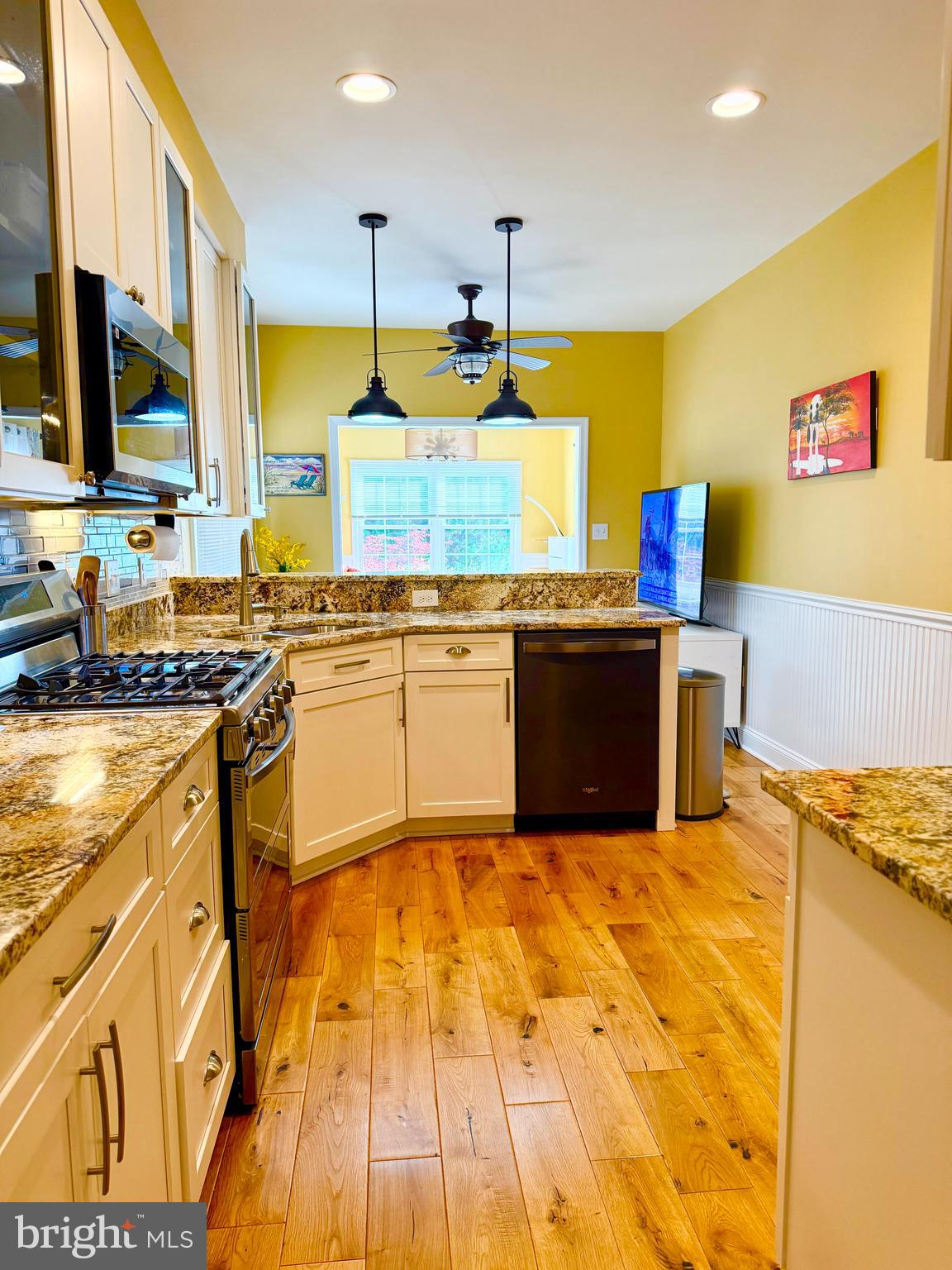2462 Five Shillings Road Frederick, MD 21701 - Photo 7 of 55 a kitchen with stainless steel appliances granite countertop a sink and cabinets