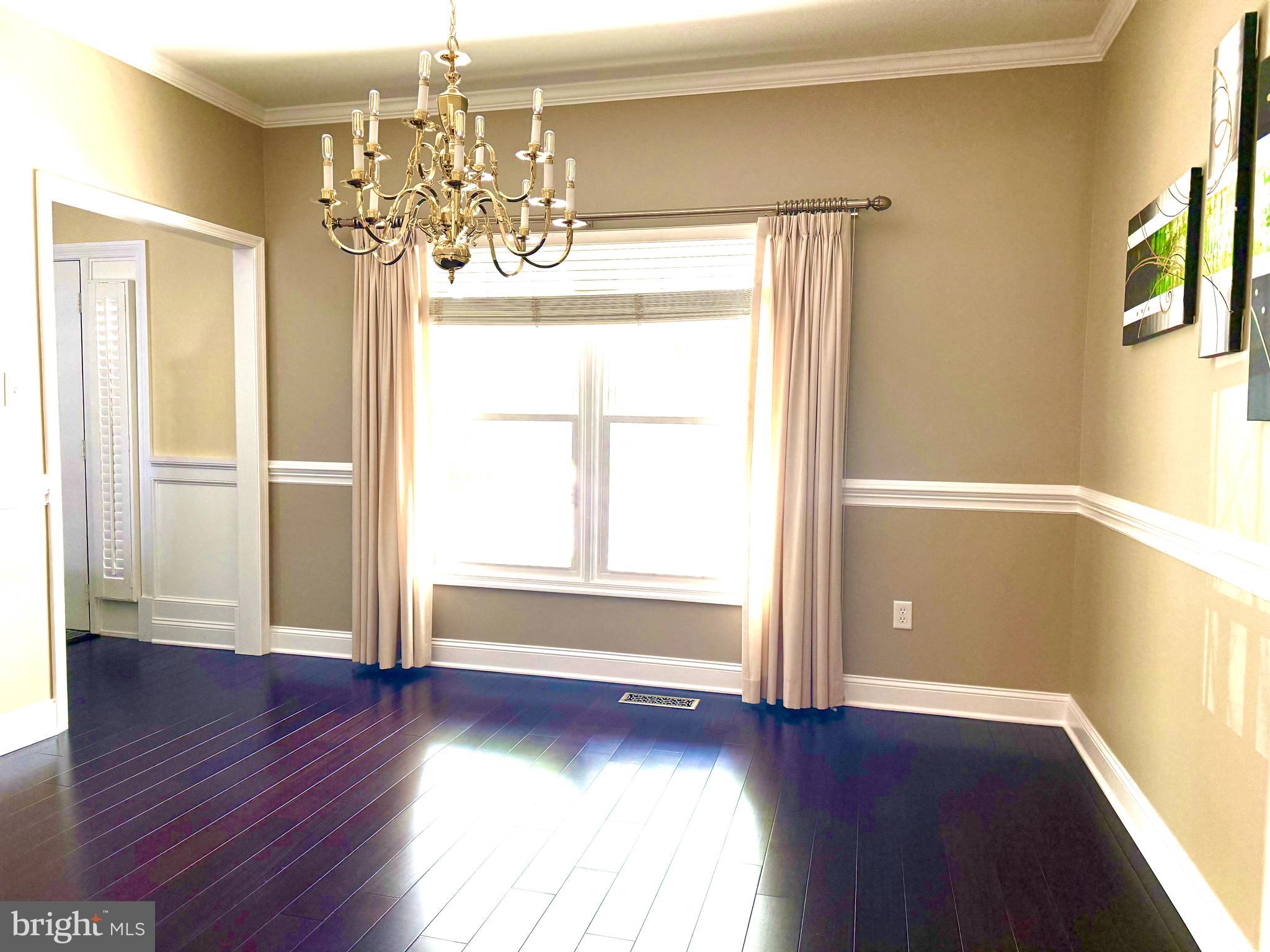 2462 Five Shillings Road Frederick, MD 21701 - Photo 9 of 55 a view of an empty room with wooden floor and a window