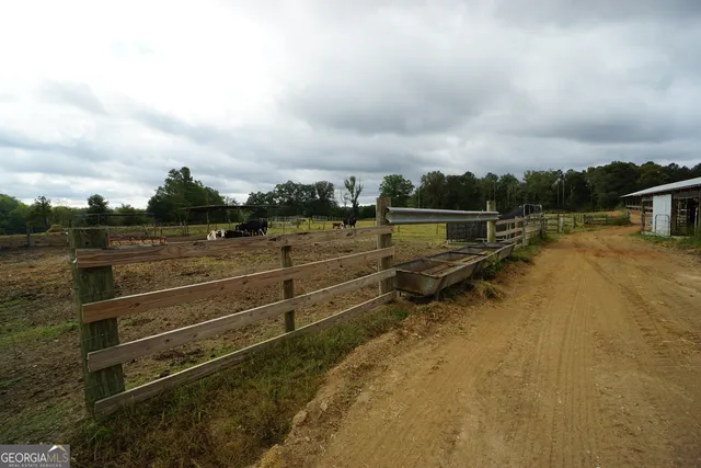 a view of a lake with houses in the back