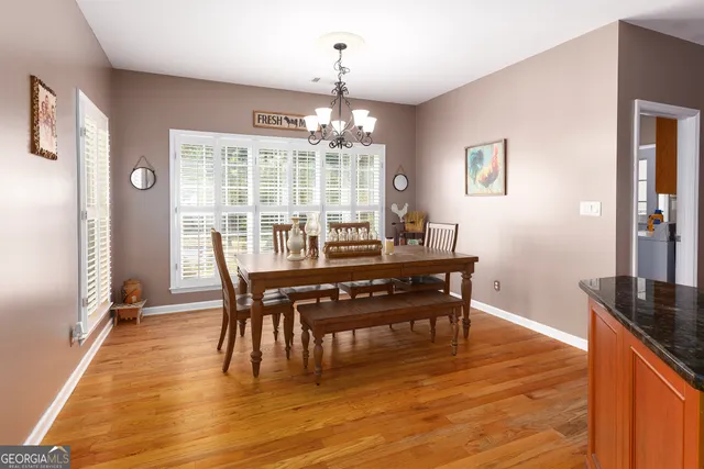 a utility room with cabinets washer and dryer
