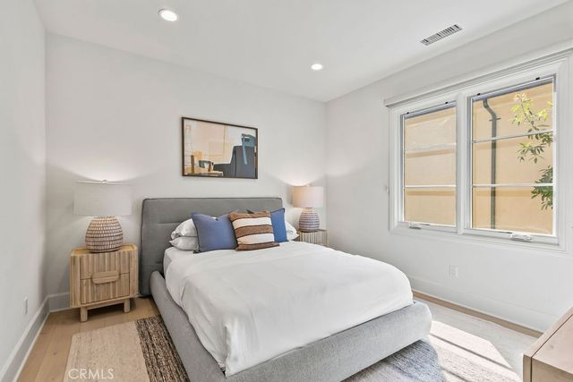 a bed room with a bed and a couch