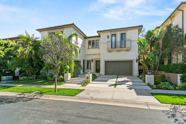 a living room with a couch and a potted plant