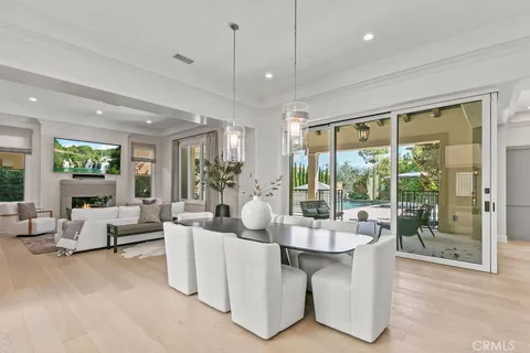 a large kitchen with stainless steel appliances kitchen island granite countertop a lot of counter space and wooden floors