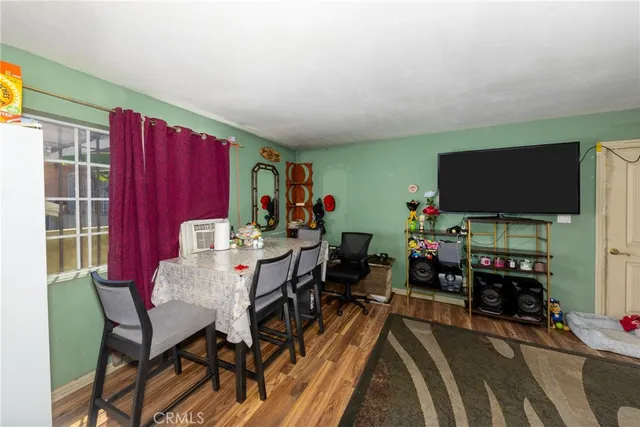 a view of a livingroom with furniture and a flat screen tv