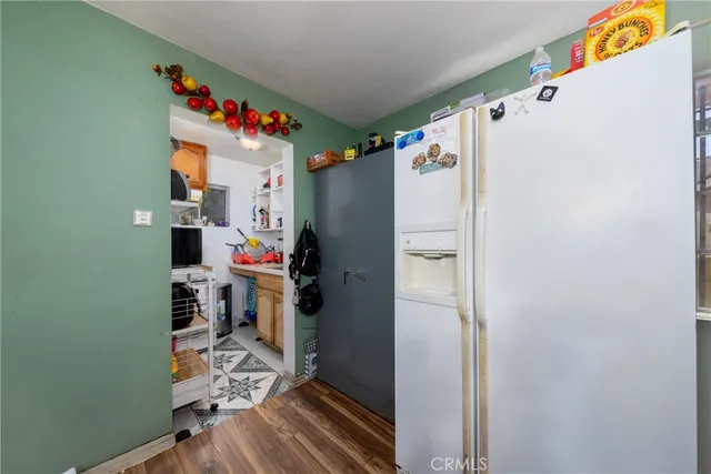 a white refrigerator freezer sitting inside of a kitchen