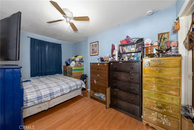 a bed room with a bed and a television